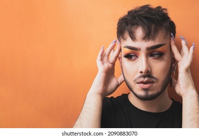 boy-makeup-posing-against-orange-260nw-2090883070.jpg