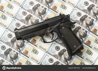 depositphotos_690733702-stock-photo-black-gun-background-cash-dollars.webp