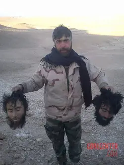 MIX-Syrian-soldiers-taking-photos-with-severed-rebel-heads-1.webp