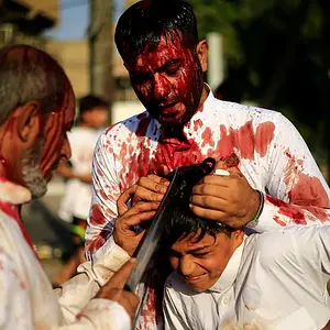 44EBB95600000578-0-Iraqi_Shi_ite_Muslims_gash_the_forehead_of_a_boy_with_a_sword_du-a-79_1506...webp